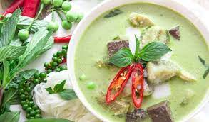 Green Curry Creamy Coconut Milk With Chicken , The Popular Thai Food Called Gaeng  Keow Wan Gai On Wooden Table Stock Photo, Picture And Royalty Free Image.  Image 44261382.